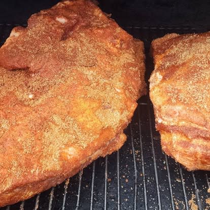 Pork shoulders on the smoker rack